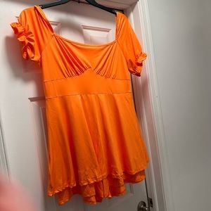 All orders ship 1-3 business days!
The color is_ orange
Romper/dress with shorts